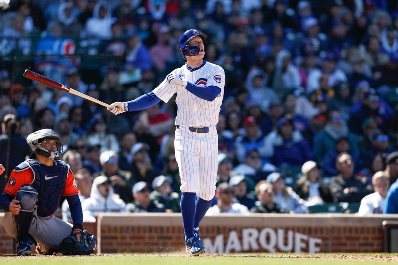 Apr 25, 2024; Chicago, Illinois, USA; Chicago Cubs centerfielder Pete Crow-Armstrong (52) hits a two-run home run against the Houston Astros during the sixth inning at Wrigley Field. Mandatory Credit: Kamil Krzaczynski-USA TODAY Sports