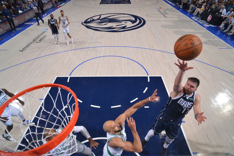 DALLAS, TX - JUNE 14: Luka Doncic #77 of the Dallas Mavericks shoots the ball during the game against the Boston Celtics during Game 4 of the 2024 NBA Finals on June 14, 2024 at the American Airlines Center in Dallas, Texas. NOTE TO USER: User expressly acknowledges and agrees that, by downloading and or using this photograph, User is consenting to the terms and conditions of the Getty Images License Agreement. Mandatory Copyright Notice: Copyright 2024 NBAE (Photo by Jesse D. Garrabrant/NBAE via Getty Images)