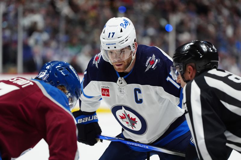 Apr 28, 2024; Denver, Colorado, USA; Winnipeg Jets center Adam Lowry (17) prepares for a face during the first period against the Colorado Avalanche in game four of the first round of the 2024 Stanley Cup Playoffs at Ball Arena. Mandatory Credit: Ron Chenoy-USA TODAY Sports