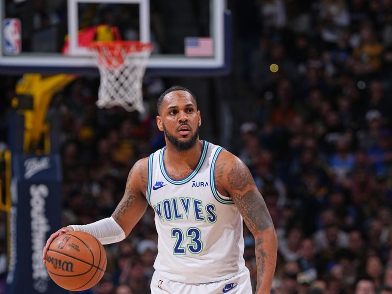 DENVER, CO - MARCH 29: Monte Morris #23 of the Minnesota Timberwolves dribbles the ball during the game against the Denver Nuggets on March 29, 2024 at the Ball Arena in Denver, Colorado. NOTE TO USER: User expressly acknowledges and agrees that, by downloading and/or using this Photograph, user is consenting to the terms and conditions of the Getty Images License Agreement. Mandatory Copyright Notice: Copyright 2024 NBAE (Photo by Bart Young/NBAE via Getty Images)