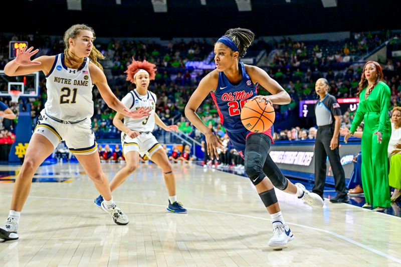 Mar 25, 2024; South Bend, Indiana, USA; Ole Miss Rebels guard Ayanna Thompson (20) dribbles as Notre Dame Fighting Irish forward Maddy Westbeld (21) defends in the first half of the NCAA Tournament second round game at the Purcell Pavilion. Mandatory Credit: Matt Cashore-USA TODAY Sports