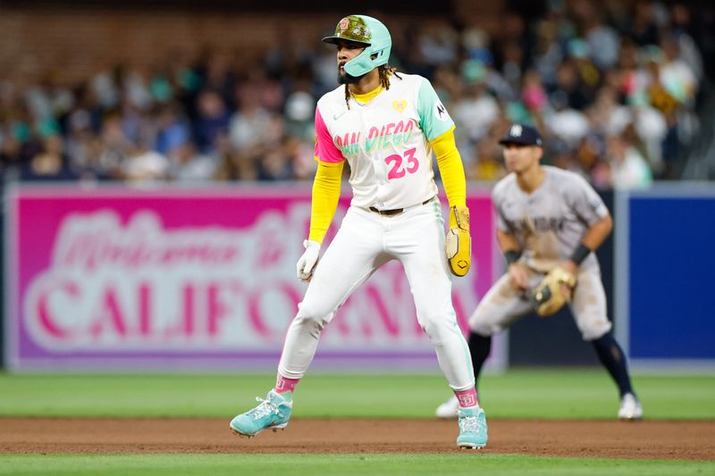 May 24, 2024; San Diego, California, USA; San Diego Padres right fielder Fernando Tatis Jr. (23) takes a few steps off second base during the fourth inning against the New York Yankees at Petco Park. Mandatory Credit: David Frerker-USA TODAY Sports