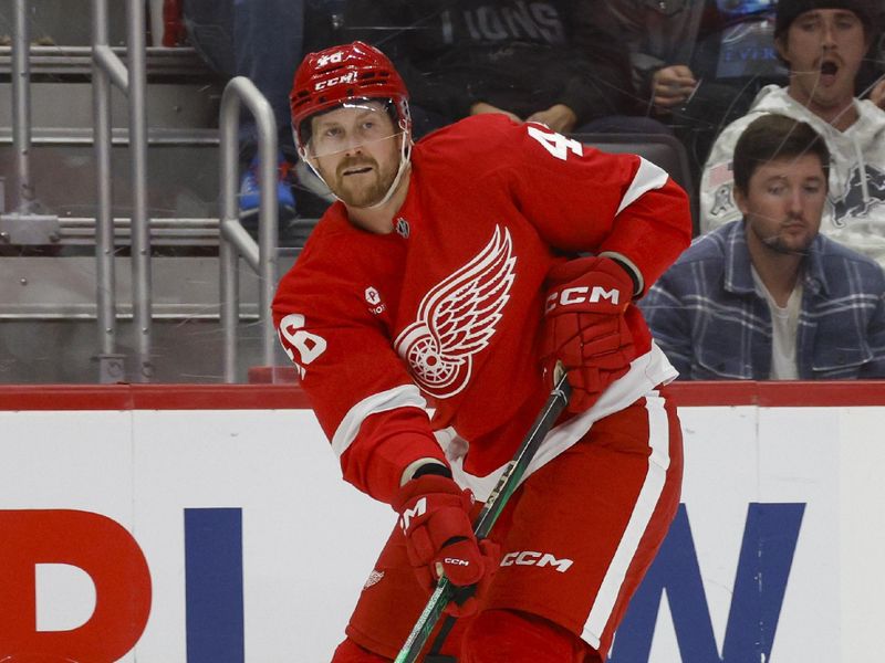 Oct 27, 2024; Detroit, Michigan, USA; Detroit Red Wings defenseman Jeff Petry (46) passes the puck during the third period of the game at Little Caesars Arena. Mandatory Credit: Brian Bradshaw Sevald-Imagn Images