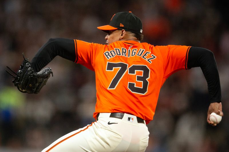 Sep 27, 2024; San Francisco, California, USA; San Francisco Giants pitcher Randy Rodriguez (73) delivers a pitch against the St. Louis Cardinals during the sixth inning at Oracle Park. Mandatory Credit: D. Ross Cameron-Imagn Images