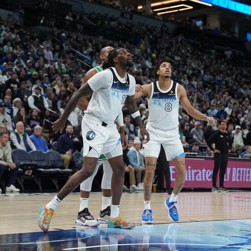 MINNEAPOLIS, MN -  JANUARY 2:  Naz Reid #11 of the Minnesota Timberwolves boxes out during the game against the Boston Celtics on January 2, 2025 at Target Center in Minneapolis, Minnesota. NOTE TO USER: User expressly acknowledges and agrees that, by downloading and or using this Photograph, user is consenting to the terms and conditions of the Getty Images License Agreement. Mandatory Copyright Notice: Copyright 2025 NBAE (Photo by Jordan Johnson/NBAE via Getty Images)