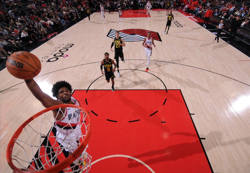 PORTLAND, OR - OCTOBER 18: Scoot Henderson #00 of the Portland Trail Blazers dunks the ball during the game against the Utah Jazz on October 18, 2024 at the Moda Center Arena in Portland, Oregon. NOTE TO USER: User expressly acknowledges and agrees that, by downloading and or using this photograph, user is consenting to the terms and conditions of the Getty Images License Agreement. Mandatory Copyright Notice: Copyright 2024 NBAE (Photo by Cameron Browne/NBAE via Getty Images)