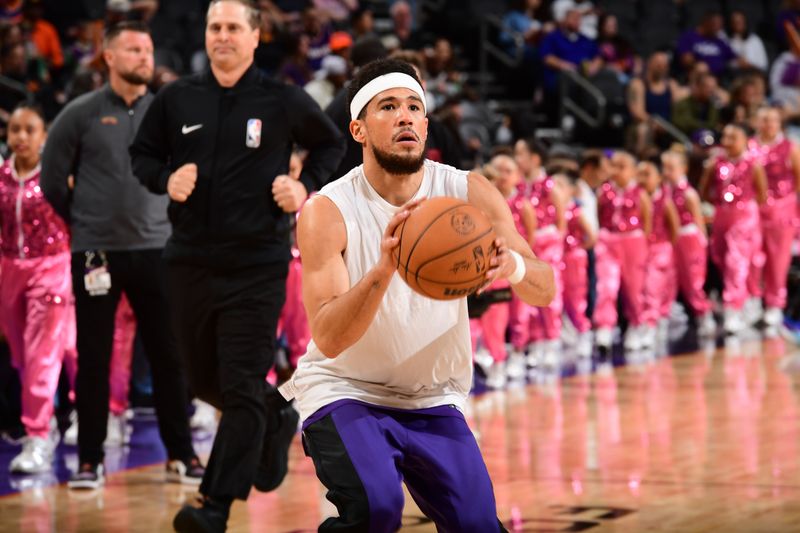 PHOENIX, AZ - MARCH 2:  Devin Booker #1 of the Phoenix Suns warms up before the game against the Houston Rockets on March 2, 2024 at Footprint Center in Phoenix, Arizona. NOTE TO USER: User expressly acknowledges and agrees that, by downloading and or using this photograph, user is consenting to the terms and conditions of the Getty Images License Agreement. Mandatory Copyright Notice: Copyright 2023 NBAE (Photo by Kate Frese/NBAE via Getty Images)