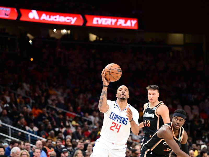 ATLANTA, GA - JANUARY 28: Norman Powell #24 of the LA Clippers drives to the basket during the game on January 28, 2023 at State Farm Arena in Atlanta, Georgia.  NOTE TO USER: User expressly acknowledges and agrees that, by downloading and/or using this Photograph, user is consenting to the terms and conditions of the Getty Images License Agreement. Mandatory Copyright Notice: Copyright 2023 NBAE (Photo by Adam Hagy/NBAE via Getty Images)