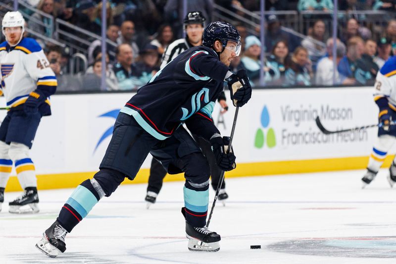 Oct 8, 2024; Seattle, Washington, USA; Seattle Kraken defenseman Jamie Oleksiak (24) moves the puck against the St. Louis Blues during the second period at Climate Pledge Arena. Mandatory Credit: Caean Couto-Imagn Images