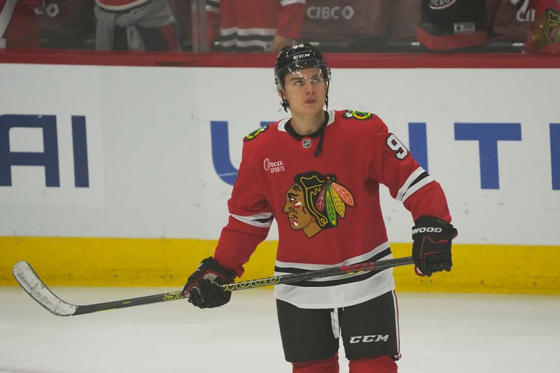 Nov 6, 2024; Chicago, Illinois, USA; Chicago Blackhawks center Connor Bedard (98) warms up before a game against the Detroit Red Wings  at United Center. Mandatory Credit: David Banks-Imagn Images