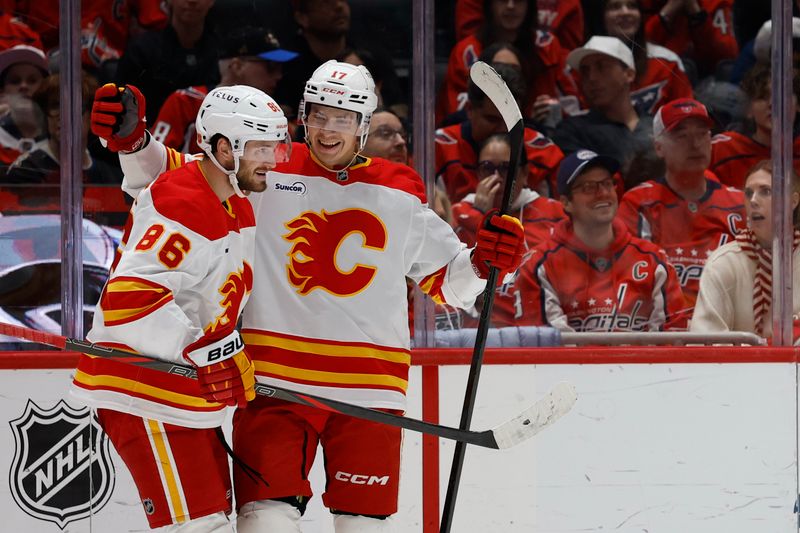 Mar 9, 2026; Washington, District of Columbia, USA; Calgary Flames center Yegor Sharangovich (17) celebrates with Flames left wing Joel Farabee (86) after scoring a goal against the Washington Capitals during the second period at Capital One Arena. Mandatory Credit: Geoff Burke-Imagn Images
