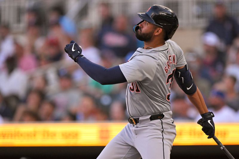 Jul 3, 2024; Minneapolis, Minnesota, USA; Detroit Tigers outfielder Riley Greene (31) hits a triple against the Minnesota Twins during the first inning at Target Field. Mandatory Credit: Nick Wosika-USA TODAY Sports