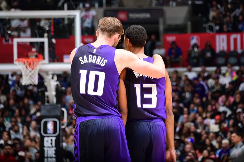 LOS ANGELES, CA - FEBRUARY 25: Domantas Sabonis #10 and Keegan Murray #13 of the Sacramento Kings talk during the game against the LA Clippers on February 25, 2024 at Crypto.Com Arena in Los Angeles, California. NOTE TO USER: User expressly acknowledges and agrees that, by downloading and/or using this Photograph, user is consenting to the terms and conditions of the Getty Images License Agreement. Mandatory Copyright Notice: Copyright 2024 NBAE (Photo by Adam Pantozzi/NBAE via Getty Images)