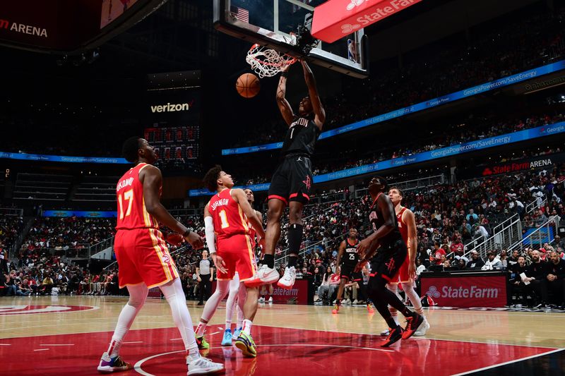 ATLANTA, GA - FEBRUARY 10: Amen Thompson #1 of the Houston Rockets dunks the ball during the game against the Atlanta Hawks on February 10, 2024 at State Farm Arena in Atlanta, Georgia.  NOTE TO USER: User expressly acknowledges and agrees that, by downloading and/or using this Photograph, user is consenting to the terms and conditions of the Getty Images License Agreement. Mandatory Copyright Notice: Copyright 2024 NBAE (Photo by Scott Cunningham/NBAE via Getty Images)