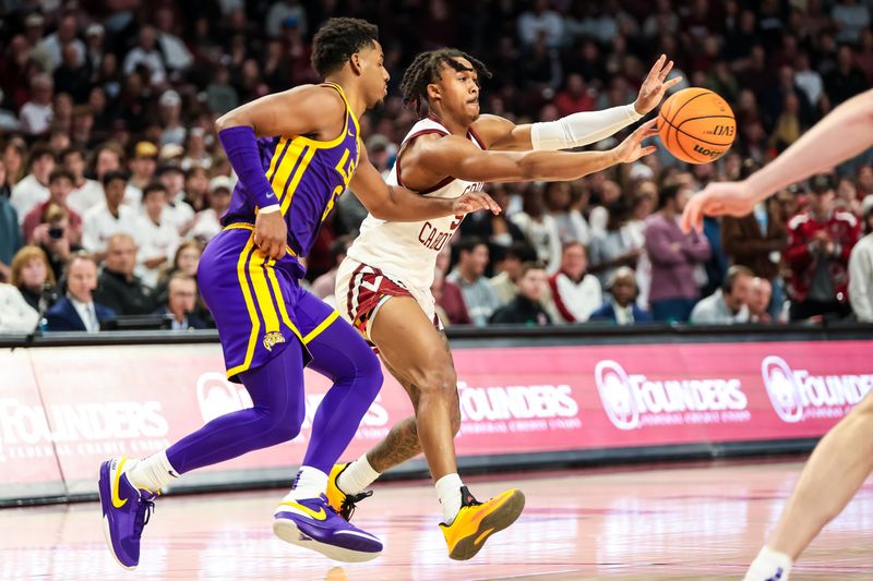 Feb 17, 2024; Columbia, South Carolina, USA; South Carolina Gamecocks guard Meechie Johnson (5) passes away from LSU Tigers guard Jordan Wright (6) in the first half at Colonial Life Arena. Mandatory Credit: Jeff Blake-USA TODAY Sports