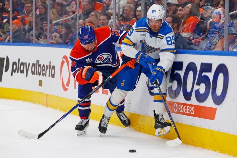 Jan 18, 2026; Edmonton, Alberta, CAN; St. Louis Blues forward Pavel Buchnevich (89) and Edmonton Oilers forward Jack Roslovic (28) battle along the boards for a loose puck during the second period at Rogers Place. Mandatory Credit: Perry Nelson-Imagn Images