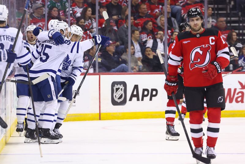 Oct 10, 2024; Newark, New Jersey, USA; The Toronto Maple Leafs celebrate a goal by Toronto Maple Leafs center John Tavares (91) against the New Jersey Devils during the second period at Prudential Center. Mandatory Credit: Ed Mulholland-Imagn Images