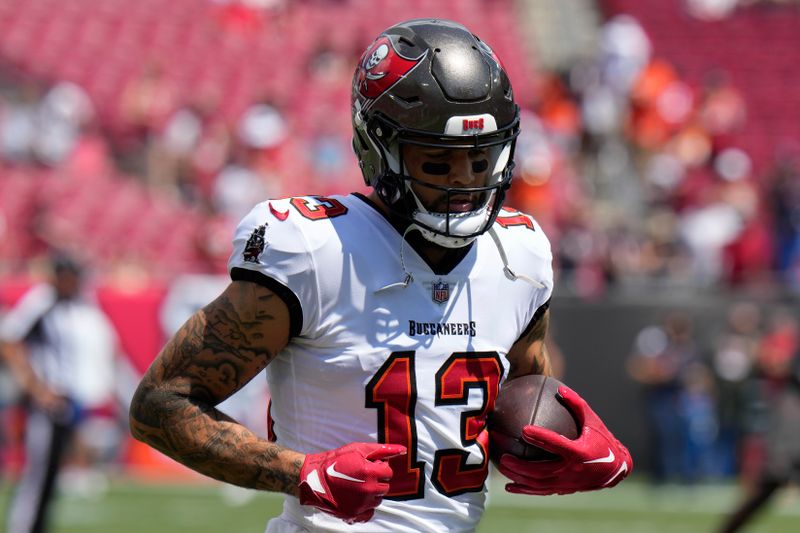 Tampa Bay Buccaneers wide receiver Mike Evans (13) runs during warmups ahead of an NFL football game against the Chicago Bears, Sunday, Sept. 17, 2023, in Tampa, Fla. (AP Photo/Chris O'Meara)