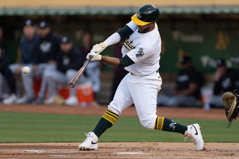 Jun 21, 2024; Oakland, California, USA; Oakland Athletics third base Abraham Toro (31) hits a single against the Minnesota Twins during the first inning at Oakland-Alameda County Coliseum. Mandatory Credit: Stan Szeto-USA TODAY Sports