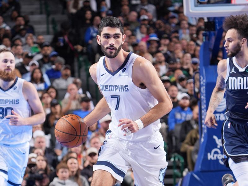 DALLAS, TX - DECEMBER 3: Santi Aldama #7 of the Memphis Grizzlies dribbles the ball during the game against the Dallas Mavericks during a Emirates NBA Cup game on December 3, 2024 at American Airlines Center in Dallas, Texas. NOTE TO USER: User expressly acknowledges and agrees that, by downloading and or using this photograph, User is consenting to the terms and conditions of the Getty Images License Agreement. Mandatory Copyright Notice: Copyright 2024 NBAE (Photo by Glenn James/NBAE via Getty Images)