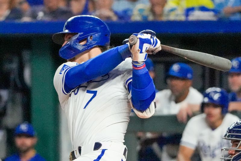 Jun 12, 2024; Kansas City, Missouri, USA; Kansas City Royals shortstop Bobby Witt Jr. (7) hits a single against the New York Yankees in the seventh inning at Kauffman Stadium. Mandatory Credit: Denny Medley-USA TODAY Sports