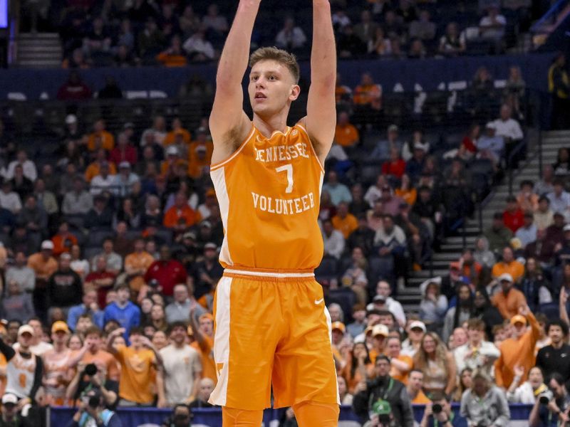 Mar 15, 2025; Nashville, TN, USA;  Tennessee Volunteers forward Igor Milicic Jr. (7) shoots a three point basket against the Auburn Tigers during the first half at Bridgestone Arena. Mandatory Credit: Steve Roberts-Imagn Images
