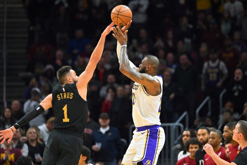 CLEVELAND, OHIO - NOVEMBER 25: LeBron James #23 of the Los Angeles Lakers shoots over Max Strus #1 of the Cleveland Cavaliers during the fourth quarter at Rocket Mortgage Fieldhouse on November 25, 2023 in Cleveland, Ohio. The Lakers defeated the Cavaliers 121-115. NOTE TO USER: User expressly acknowledges and agrees that, by downloading and or using this photograph, User is consenting to the terms and conditions of the Getty Images License Agreement. (Photo by Jason Miller/Getty Images)