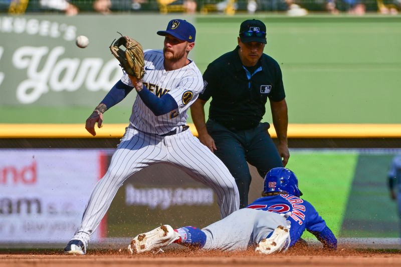 Oct 1, 2023; Milwaukee, Wisconsin, USA; Chicago Cubs center fielder Pete Crow-Armstrong (52) steals second base as Milwaukee Brewers second baseman Brice Turang (2) takes the throw in the fifth inning at American Family Field. Mandatory Credit: Benny Sieu-USA TODAY Sports