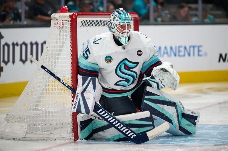 Apr 5, 2025; San Jose, California, USA; Seattle Kraken goaltender Joey Daccord (35) watches the play against the San Jose Sharks during the second period at SAP Center at San Jose. Mandatory Credit: Robert Edwards-Imagn Images