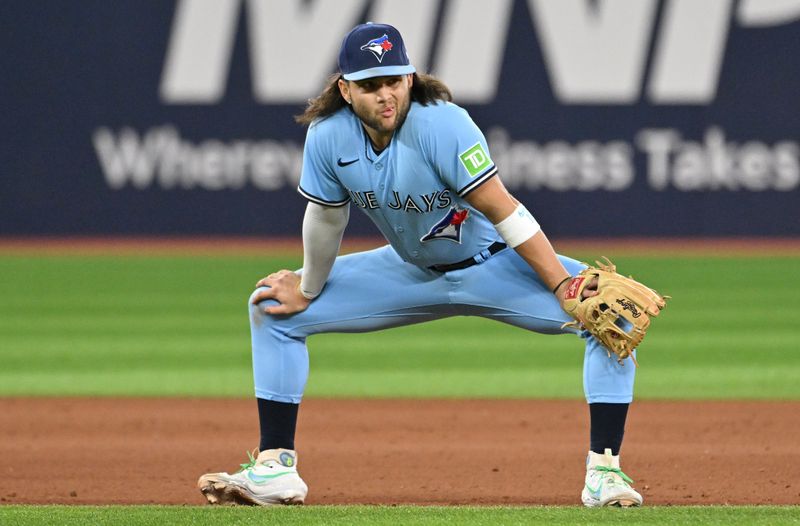 Sep 14, 2023; Toronto, Ontario, CAN;  Toronto Blue Jays shortstop Bo Bichette (11) waits for play to resume against the Texas Rangers in the eighth inning at Rogers Centre. Mandatory Credit: Dan Hamilton-USA TODAY Sports