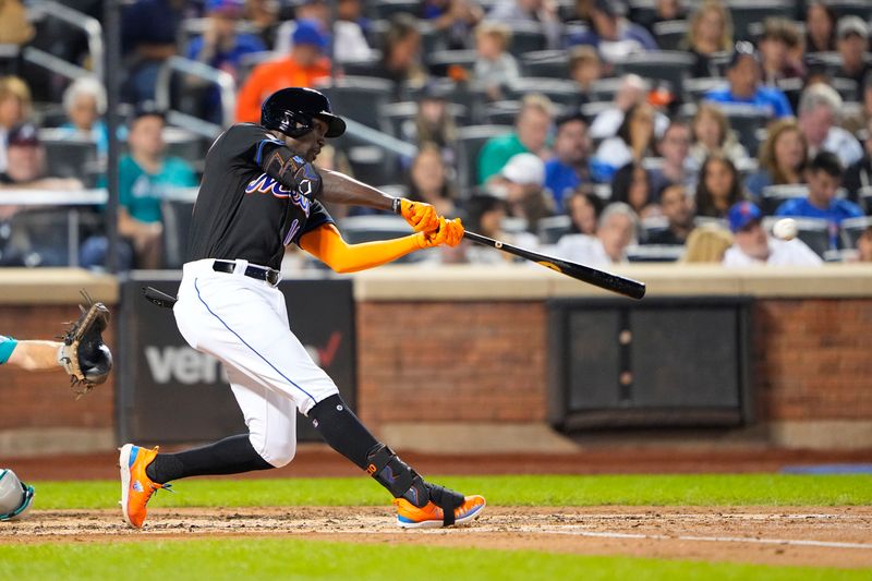 Sep 1, 2023; New York City, New York, USA; New York Mets second baseman Ronny Mauricio (10) hits a double against the Seattle Mariners during the second inning at Citi Field. Mandatory Credit: Gregory Fisher-USA TODAY Sports