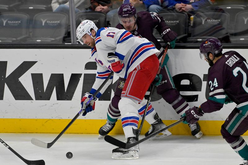 Jan 21, 2024; Anaheim, California, USA; New York Rangers right wing Blake Wheeler (17) and Anaheim Ducks center Sam Carrick (39) battle for the puck in the first period at Honda Center. Mandatory Credit: Jayne Kamin-Oncea-USA TODAY Sports