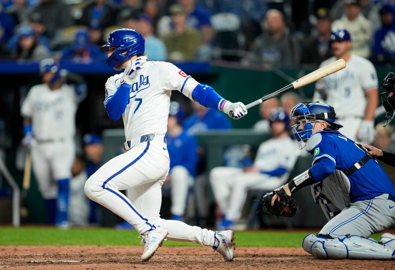 Apr 22, 2024; Kansas City, Missouri, USA; Kansas City Royals shortstop Bobby Witt Jr. (7) hits a single against the Toronto Blue Jays during the eighth inning at Kauffman Stadium. Mandatory Credit: Jay Biggerstaff-USA TODAY Sports