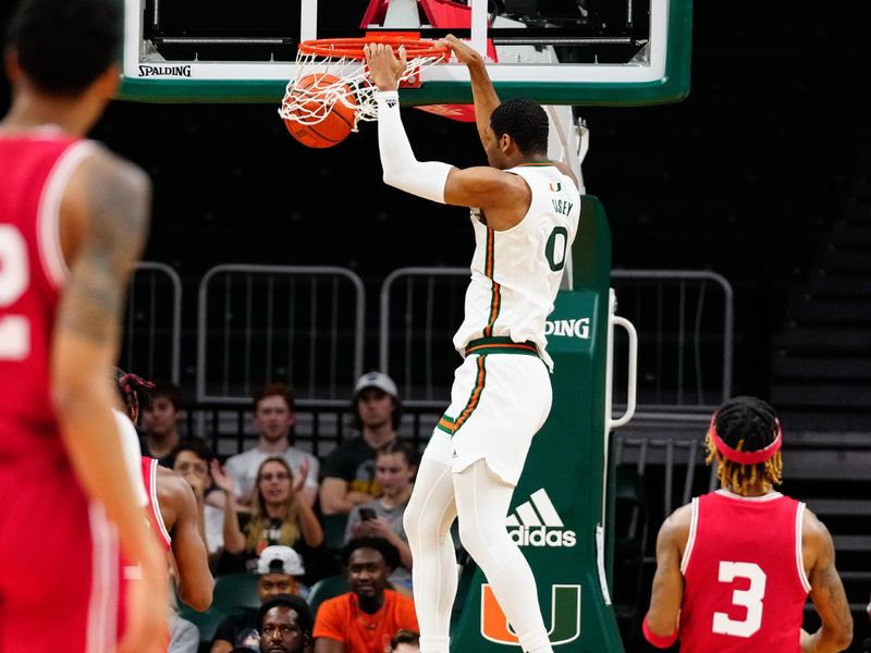 Feb 11, 2023; Coral Gables, Florida, USA; Miami (Fl) Hurricanes forward A.J. Casey (0) dunks the ball against the Louisville Cardinals during the first half at Watsco Center. Mandatory Credit: Rich Storry-USA TODAY Sports