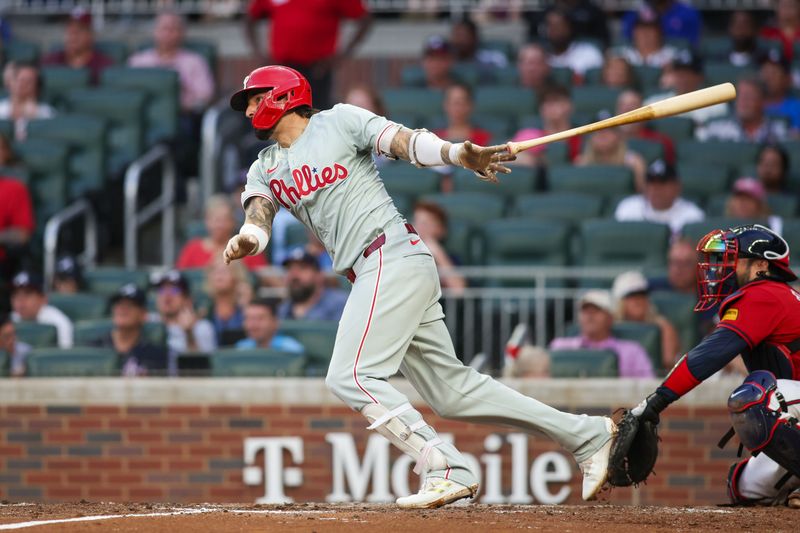 Jul 5, 2024; Atlanta, Georgia, USA; Philadelphia Phillies right fielder Nick Castellanos (8) hits a single against the Atlanta Braves in the fourth inning at Truist Park. Mandatory Credit: Brett Davis-USA TODAY Sports