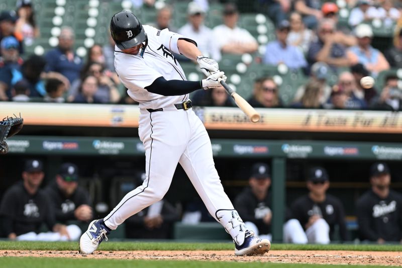 Apr 18, 2024; Detroit, Michigan, USA;  Detroit Tigers first base Spencer Torkelson (20) hits a double against the Texas Rangers in the fourth inning at Comerica Park. Mandatory Credit: Lon Horwedel-USA TODAY Sports