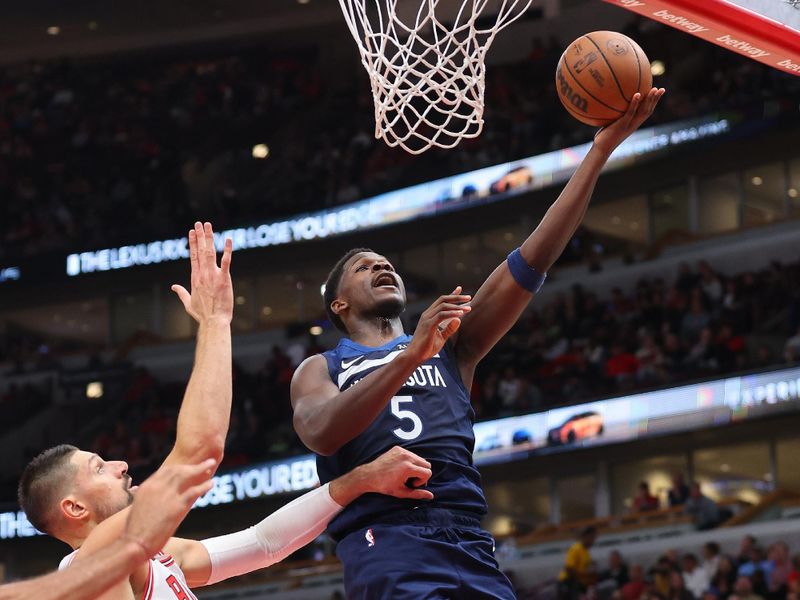 CHICAGO, ILLINOIS - OCTOBER 19: Anthony Edwards #5 of the Minnesota Timberwolves goes up for a layup against the Chicago Bulls during the first half of a preseason game at the United Center on October 19, 2023 in Chicago, Illinois. NOTE TO USER: User expressly acknowledges and agrees that, by downloading and or using this photograph, User is consenting to the terms and conditions of the Getty Images License Agreement.  (Photo by Michael Reaves/Getty Images)