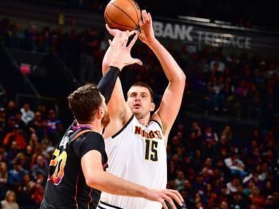 PHOENIX, AZ - DECEMBER 1: Nikola Jokic #15 of the Denver Nuggets shoots the ball during the game against the Phoenix Suns on December 1, 2023 at Footprint Center in Phoenix, Arizona. NOTE TO USER: User expressly acknowledges and agrees that, by downloading and or using this photograph, user is consenting to the terms and conditions of the Getty Images License Agreement. Mandatory Copyright Notice: Copyright 2023 NBAE (Photo by Barry Gossage/NBAE via Getty Images)