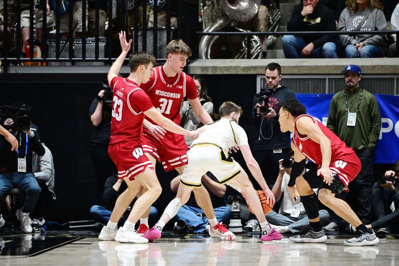 Feb 15, 2025; West Lafayette, Indiana, USA; Purdue Boilermakers guard Braden Smith (3) is surrounded by Wisconsin Badgers during the first half at Mackey Arena. Mandatory Credit: Marc Lebryk-Imagn Images