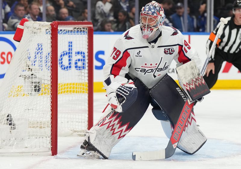 Dec 6, 2024; Toronto, Ontario, CAN; Washington Capitals goaltender Charlie Lindgren (79) follows the play against the Toronto Maple Leafs during the first period at Scotiabank Arena. Mandatory Credit: Nick Turchiaro-Imagn Images