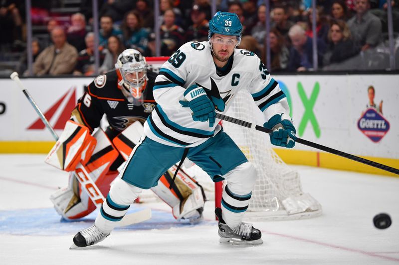 Jan 31, 2024; Anaheim, California, USA; San Jose Sharks center Logan Couture (39) plays for the puck against the Anaheim Ducks during the first period at Honda Center. Mandatory Credit: Gary A. Vasquez-USA TODAY Sports