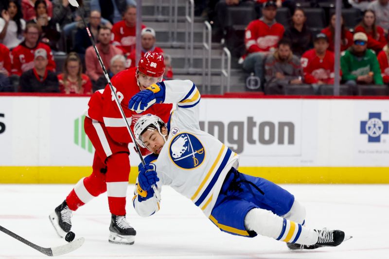 Mar 16, 2024; Detroit, Michigan, USA;  Detroit Red Wings right wing Patrick Kane (88) fouls Buffalo Sabres center Tyson Jost (17) in the first period at Little Caesars Arena. Mandatory Credit: Rick Osentoski-USA TODAY Sports