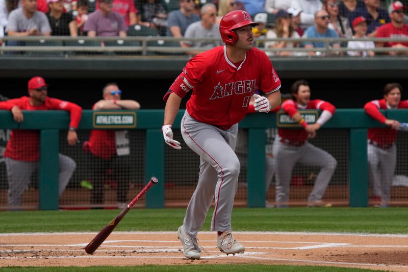 Mar 23, 2024; Mesa, Arizona, USA; Los Angeles Angels first baseman Nolan Schanuel (18) hits a two run home run against the Oakland Athletics in the first inning at Hohokam Stadium. Mandatory Credit: Rick Scuteri-USA TODAY Sports