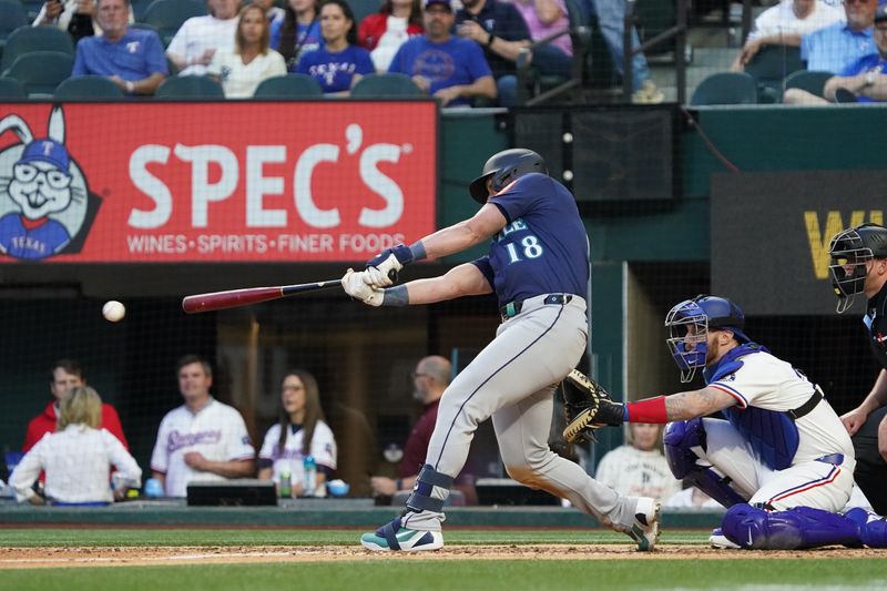 May 3, 2025; Arlington, Texas, USA; Seattle Mariners catcher Mitch Garver (18) hits a single during the sixth inning against the Texas Rangers at Globe Life Field. Mandatory Credit: Raymond Carlin III-Imagn Images