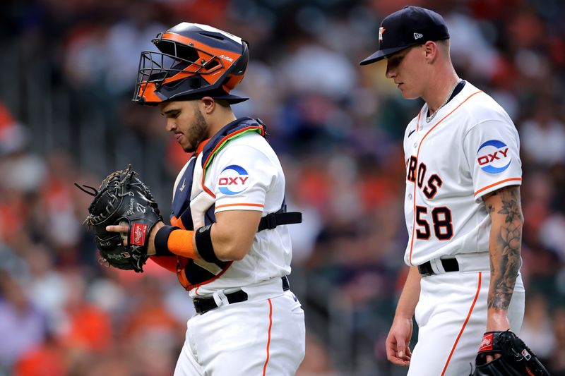 May 2, 2023; Houston, Texas, USA; Houston Astros catcher Yainer Diaz (21) and starting pitcher Hunter Brown (58) walk to the dugout after retiring the side against the San Francisco Giants during the third inning at Minute Maid Park. Mandatory Credit: Erik Williams-USA TODAY Sports