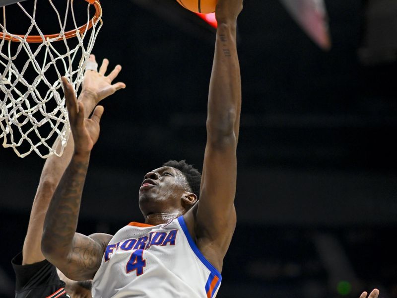 Mar 14, 2024; Nashville, TN, USA;  Florida Gators forward Tyrese Samuel (4) lays the ball up against the Georgia Bulldogs during the second half at Bridgestone Arena. Mandatory Credit: Steve Roberts-USA TODAY Sports