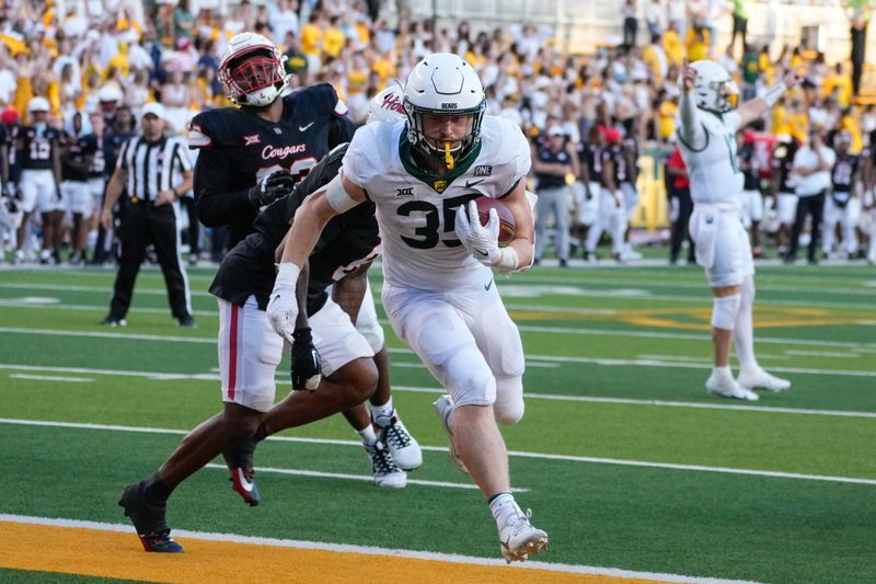 Nov 4, 2023; Waco, Texas, USA;  Baylor Bears running back Dawson Pendergrass (35) runs the ball for a touchdown against the Houston Cougars during overtime at McLane Stadium. Mandatory Credit: Chris Jones-USA TODAY Sports