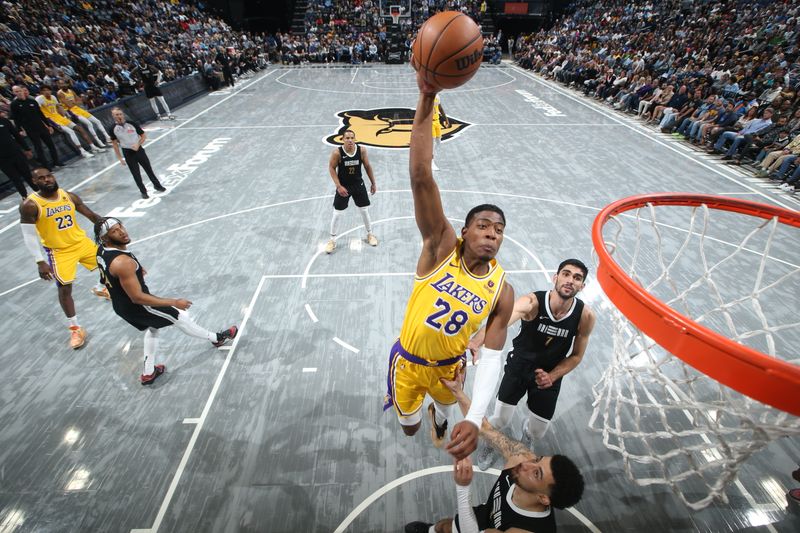 MEMPHIS, TN - MARCH 27: Rui Hachimura #28 of the Los Angeles Lakers drives to the basket during the game against the Memphis Grizzlies on March 27, 2024 at FedExForum in Memphis, Tennessee. NOTE TO USER: User expressly acknowledges and agrees that, by downloading and or using this photograph, User is consenting to the terms and conditions of the Getty Images License Agreement. Mandatory Copyright Notice: Copyright 2024 NBAE (Photo by Joe Murphy/NBAE via Getty Images)