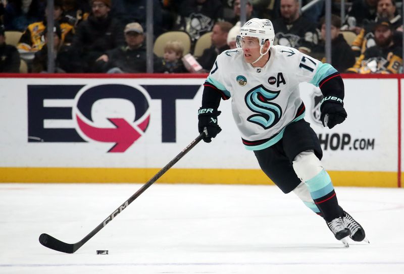 Jan 14, 2025; Pittsburgh, Pennsylvania, USA;  Seattle Kraken center Jaden Schwartz (17) skates up ice ice with the puck against the Pittsburgh Penguins during the second period at PPG Paints Arena. Mandatory Credit: Charles LeClaire-Imagn Images