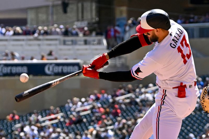 Apr 26, 2023; Minneapolis, Minnesota, USA; Minnesota Twins infielder Joey Gallo (13) hits a fly ball against the New York Yankees during the third inning at Target Field. Mandatory Credit: Nick Wosika-USA TODAY Sports

